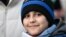 Hassan Al-Khalaf, 11, who escaped Ukraine on his own to join his brother studying in Slovakia, attends an anti-war rally, following Russia's invasion of Ukraine, in Bratislava, Slovakia, March 11, 2022.