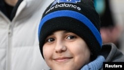 Hassan Al-Khalaf, 11, who escaped Ukraine on his own to join his brother studying in Slovakia, attends an anti-war rally, following Russia's invasion of Ukraine, in Bratislava, Slovakia, March 11, 2022.