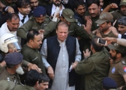 FILE - Pakistani former Prime Minister Nawaz Sharif arrives at a court in Lahore, Oct. 11, 2019.