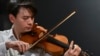 Classical violinist Stefan Jackiw plays the Joachim-Ma Stradivarius violin during a preview of the violin's auction at Sotheby’s in New York, Feb. 3, 2025.