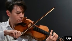 Classical violinist Stefan Jackiw plays the Joachim-Ma Stradivarius violin during a preview of the violin's auction at Sotheby’s in New York, Feb. 3, 2025.