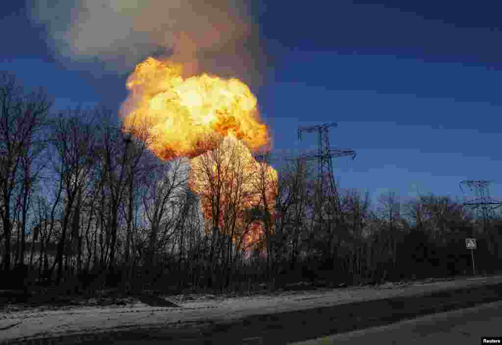 A view of an explosion after shelling is seen not far from Debaltseve, Ukraine. Government forces and pro-Russian separatists said they would not carry out an agreement to pull back heavy guns in east Ukraine.