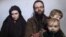 In this still image taken from a December 2016 video released by the Afghan Taliban, U.S. national Caitlan Coleman and her Canadian husband, Joshua Boyle read a statement urging then-President-elect Donald Trump to negotiate to secure their release.