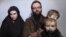 In this still image taken from a December 2016 video released by the Afghan Taliban, U.S. national Caitlan Coleman and her Canadian husband, Joshua Boyle read a statement urging then-President-elect Donald Trump to negotiate to secure their release.
