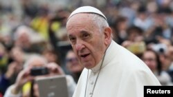 Pope Francis arrives to lead his Wednesday general audience in Saint Peter's square at the Vatican, Nov. 15, 2017. 