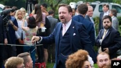 Radio host Sebastian Gorka, who was seated as a guest, moves to confront a journalist after President Donald Trump spoke about the 2020 census in the Rose Garden of the White House, Thursday, July 11, 2019, in Washington. (AP Photo/Alex Brandon)