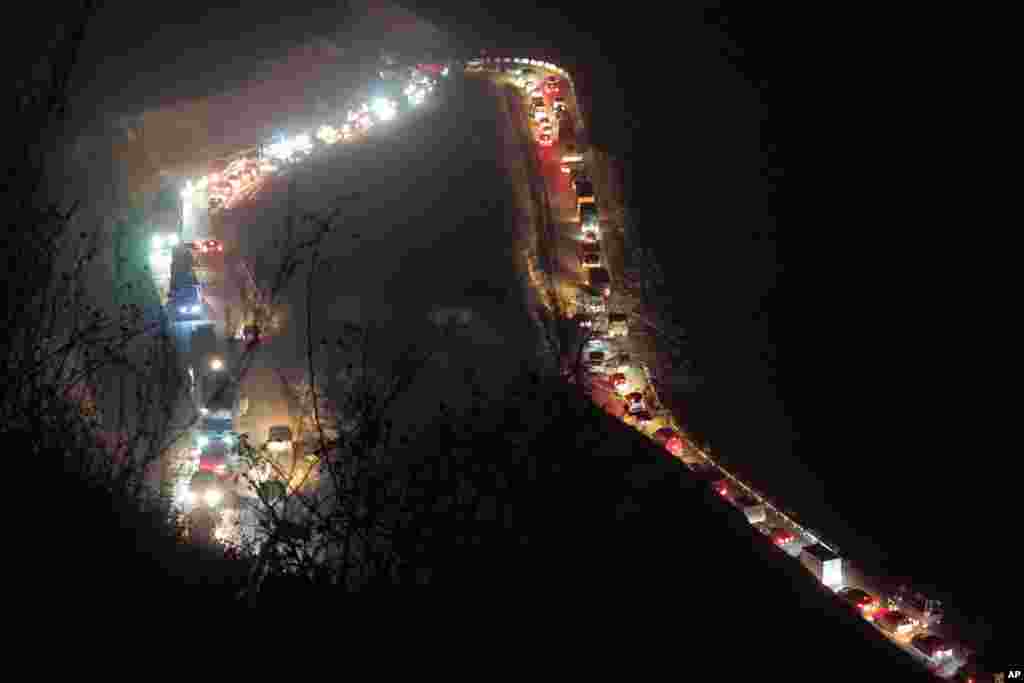 Cars and trucks stuck in a huge traffic jam are seen on the road from Kalbajar to a mountain pass leaving the separatist region of Nagorno-Karabakh to Armenia, Nov. 14, 2020.