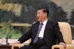 FILE - Chinese President Xi Jinping speaks during a meeting at the Great Hall of the People in Beijing, China, Jan. 28, 2020.