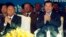 Cambodian Prime Minister Hun Sen, front right, applauses together with the National Assembly President Heng Samrin, front left, during an event by the ruling Cambodian People's Party, file photo. 