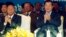 Cambodian Prime Minister Hun Sen, front right, applauses together with the National Assembly President Heng Samrin, front left, during an event by the ruling Cambodian People's Party marking the 36th anniversary of the 1979 downfall of the Khmer Rouge reg