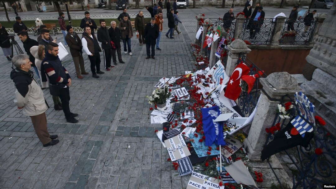 People visit the site of the Obelisk of Theodosius where Tuesday's suicide bomb attack took place at Sultanahmet Square in Istanbul, Turkey, Jan. 14, 2016.