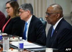 FILE— US Defense Secretary Lloyd Austin (R) meets with Israeli Defense Minister Yoav Gallant at the Pentagon in Washington, DC, on March 26, 2024.