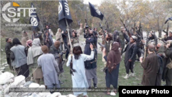 FILE - Fighters with IS-Khorasan, the affiliate in Afghanistan, vow allegiance to IS leader Abu Ibrahim al-Hashimi al-Qurashi, in this photo issued Nov. 5, 2019, by SITE Intelligence Group.