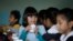 FILE - Students are served breakfast at the Stanley Mosk Elementary School in Los Angeles, April 8, 2015. (AP Photo/Nick Ut)