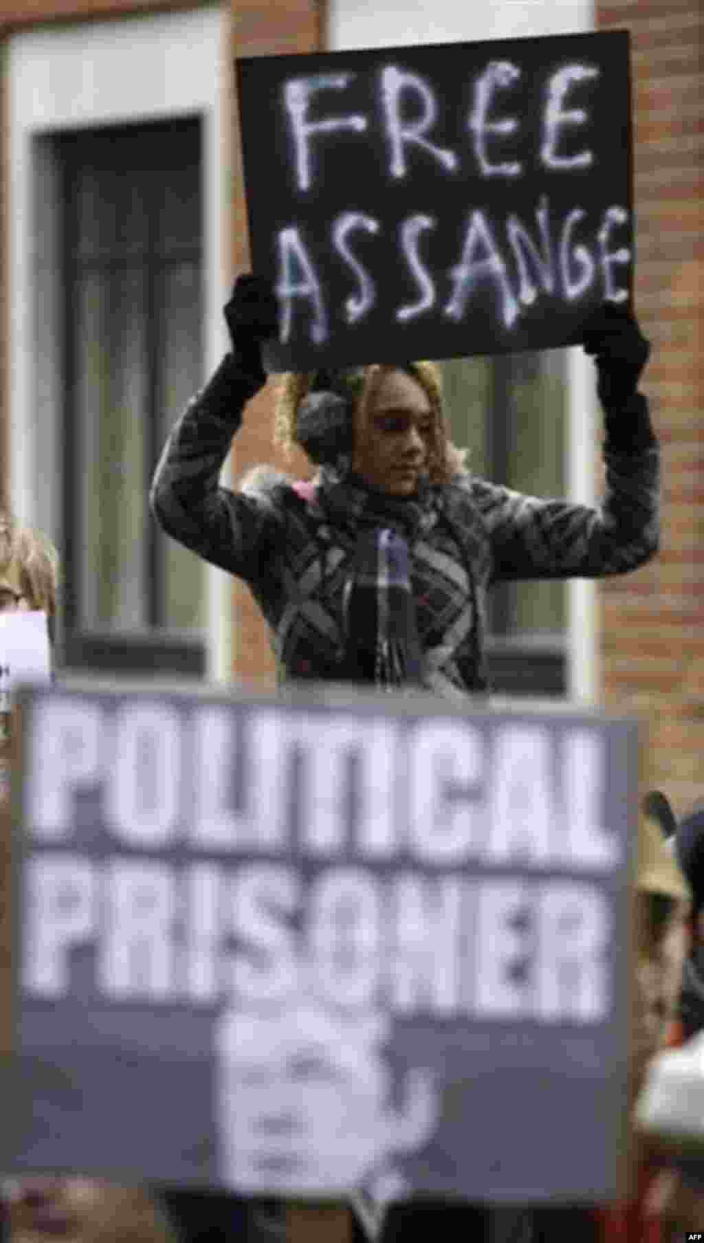 Supporters of Wikileaks founder Julian Assange demonstrates outside the City of Westminster Magistrates Court in London where Julian Assange is in court for his bail hearing, Tuesday, Dec. 14, 2010. Julian Assange was granted bail at the City of Westminst