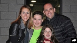 This 2016 photo provided by the family shows Jake Kestler, center, with his parents, Gallite and Josh, and his sister, Lily. This is one month before he was diagnosed with brain cancer. (Family Photo via AP)