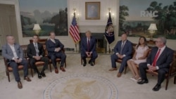 President Donald Trump talks to former U.S. hostages during a segment recorded at the White House, which aired during the first night of the Republican National Convention, Aug. 23, 2020.