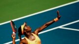 Sloane Stephens of the U.S. serves to Agnieszka Radwanska of Poland during the women&#39;s tennis match at day four of the Rogers Cup tennis tournament in Toronto, Canada. 
