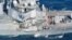 The Arleigh Burke-class guided-missile destroyer USS Fitzgerald, damaged by colliding with a Philippine-flagged merchant vessel, is seen off Shimoda, Japan, June 17, 2017, in this photo taken by Kyodo.