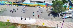 Children are seen playing at a newly-restored playground in Raqqa, Syria, June 25, 2019. (Courtesy photo)