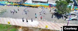 Children are seen playing at a newly-restored playground in Raqqa, Syria, June 25, 2019. (Courtesy photo)