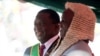 Zimbabwe's President Emmerson Mnangagwa is congratulated by the Chief Justice, Luke Malaba, after taking the oath of office during his presidential inauguration ceremony in Harare, Aug. 26, 2018. 