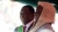 Zimbabwe's President Emmerson Mnangagwa is congratulated by the Chief Justice, Luke Malaba, after taking the oath of office during his presidential inauguration ceremony in Harare, Aug. 26, 2018. 
