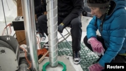 Margit Schwikowski is pictured as scientists from the Ice Memory Project prepare to drill on Monte Rosa in this June 2021 handout photo. Picture taken June 2021. (Photo courtesy of Enrico Costa for Ca' Foscari University of Venice/Handout via REUTERS) 