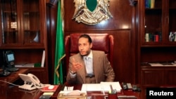 FILE - Saadi Gadhafi, a son of Libyan leader Muammar Gadhafi, speaks during a news conference at his office in Tripoli January 31, 2010.