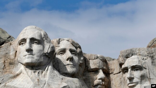 FILE - This March 22, 2019, file photo shows Mount Rushmore in Keystone, S.D. Organizers have scrapped plans to mandate social distancing during President Donald Trump's appearance at a July 3, 2020, Mount Rushmore fireworks display and won't limit…