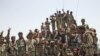 Members of the Republican Guards Force gather for a group picture at the frontline of fighting against al Qaeda-linked militants in the southern Yemeni province of Abyan, June 10, 2012. 