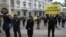 FILE - Amnesty International activists stage a flash mob asking for truth on the death of Italian student Guido Regeni, in front of Milan's city hall, Italy, April 24, 2016.