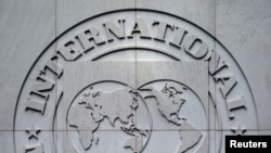 FILE PHOTO: International Monetary Fund logo is seen inside the headquarters at the end of the IMF/World Bank annual meetings