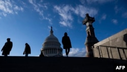 FILE - Visitors walk on the grounds of the US Capitol building in Washington, Jan. 2, 2025.