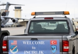 FILE - A service vehicle with a sign reading 'Welcome to Incirlik' is pictured at Incirlik Air Base, near Adana, Turkey, Jan. 21, 2016.