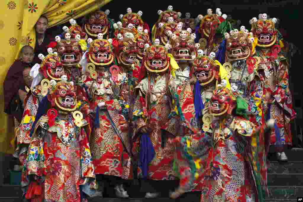 Tibetan Buddhist monks perform a dance called &#39;cham&#39; wearing traditional masks, at the Sherabling monastery, about 70 kilometers (40 miles) south of Dharmsala, India. The dances are performed to celebrate the life of the 8th century Indian seer Padmasambhava, who is revered by Tibetans for his role in spreading Buddhism in Tibet.