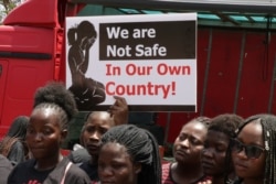 FILE - In November, the Women Doctors Assocation of Malawi held a demonstration against increasing cases of defilement and sexual abuse. Many protesters did not wear face masks. (Lameck Masina/VOA)