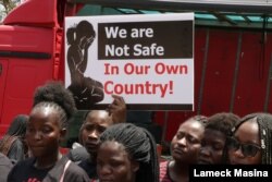 FILE - In November, the Women Doctors Assocation of Malawi held a demonstration against increasing cases of defilement and sexual abuse. Many protesters did not wear face masks. (Lameck Masina/VOA)