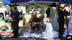 FILE: A coffin carrying the body of former Zimbabwean President Robert Mugabe is seen during mass at his rural home in Kutama, Zvimba district, about 100 kilometers northwest of the capital Harare, Sept. 28, 2019. 