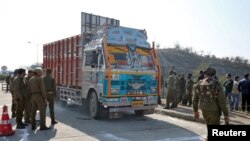 Indian security forces stand around a truck which was used by suspected militants, at the site of a gun battle at Nagrota, on the outskirts of Jammu, January 31, 2020. 
