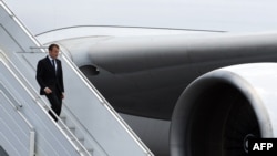 FILE - French President Emmanuel Macron arrives at the Felix Eboue airport in Cayenne, Guiana, Oct. 26, 2017. Macron heads to Africa Monday on a three-nation tour.