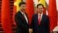FILE - Chinese President Xi Jinping, left, poses for a photo with Vietnam's Prime Minister Nguyen Tan Dung before their meeting in Hanoi, Nov. 5, 2015. 