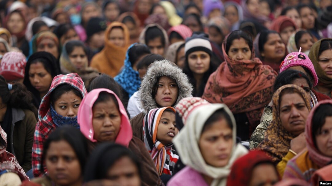 FILE - Women attend a prayer ceremony after a rally pushing for justice and security for women at Raj Ghat in New Delhi, Jan. 2, 2013.