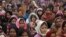 FILE - Women attend a prayer ceremony after a rally pushing for justice and security for women at Raj Ghat in New Delhi, Jan. 2, 2013.