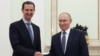 In this pool photograph distributed by the Russian state agency Sputnik on July 25, 2024, Russia's President Vladimir Putin, right, shakes hands with Syria's President Bashar al-Assad during their meeting at the Kremlin in Moscow on July 24, 2024.