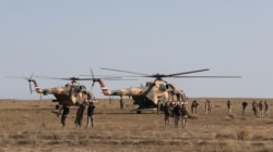 FILE - Iraqi security forces are seen during military operations to search for Islamic State militants in Anbar province, Iraq, Dec. 29, 2019.