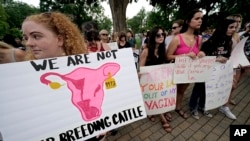 FILE - Abortion-rights advocates gather outside a the Kansas Statehouse to protest the U.S. Supreme Court's ruling on abortion, June 24, 2022, in Topeka, Kan. 