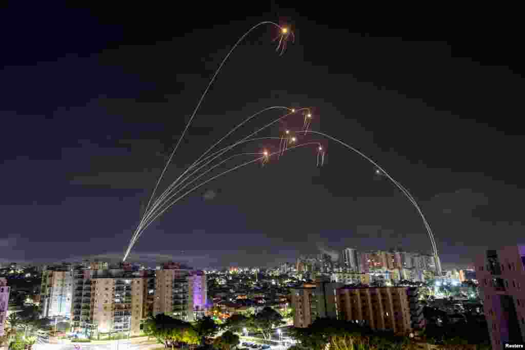 Israel&#39;s Iron Dome anti-missile system intercepts rockets launched from the Gaza Strip, as seen from Ashkelon in southern Israel, Oct. 8, 2023.