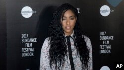 FILE - Jessica Williams poses for photographers during a photo call to promote the opening of the Sundance Film Festival in London, June 1, 2017.