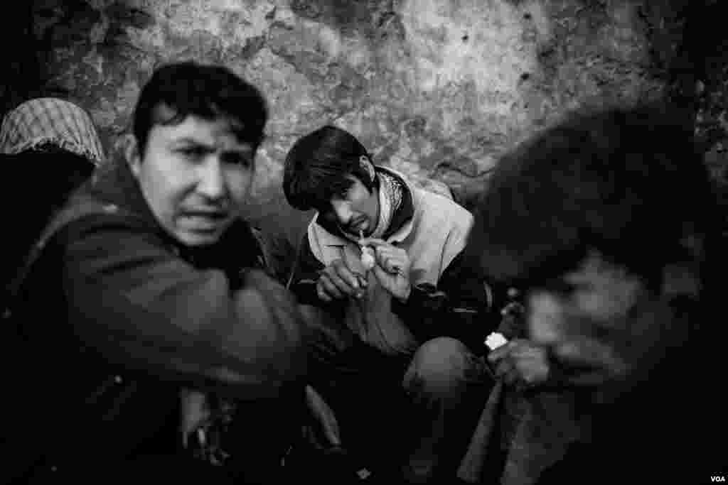 Mohammed Reza, a homeless drug user, smoking methamphetamine under the bridge in Pul-e-Sukhta area in Kabul. (Maciej Stanik/VOA)